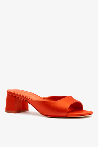 Chloe Gosselin by Larroudé Anah Mule In Orange Sunrise Satin