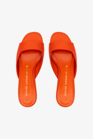 Chloe Gosselin by Larroudé Anah Mule In Orange Sunrise Satin