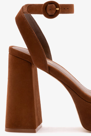 Brown high-heeled shoe on a white background