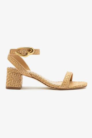Beige sandal with woven design on a white background